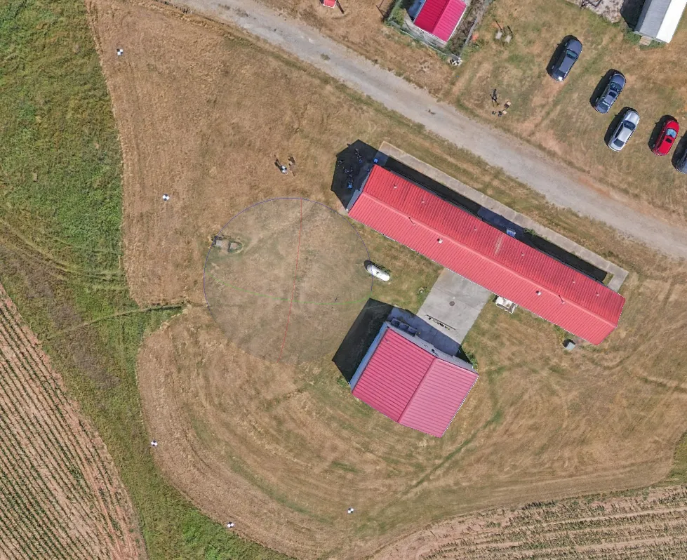 Orthomosaic of the Lake Wheeler barn and surrounding fields from the September 2026 flight, with checkerboard ground control targets visible on the ground around the buildings